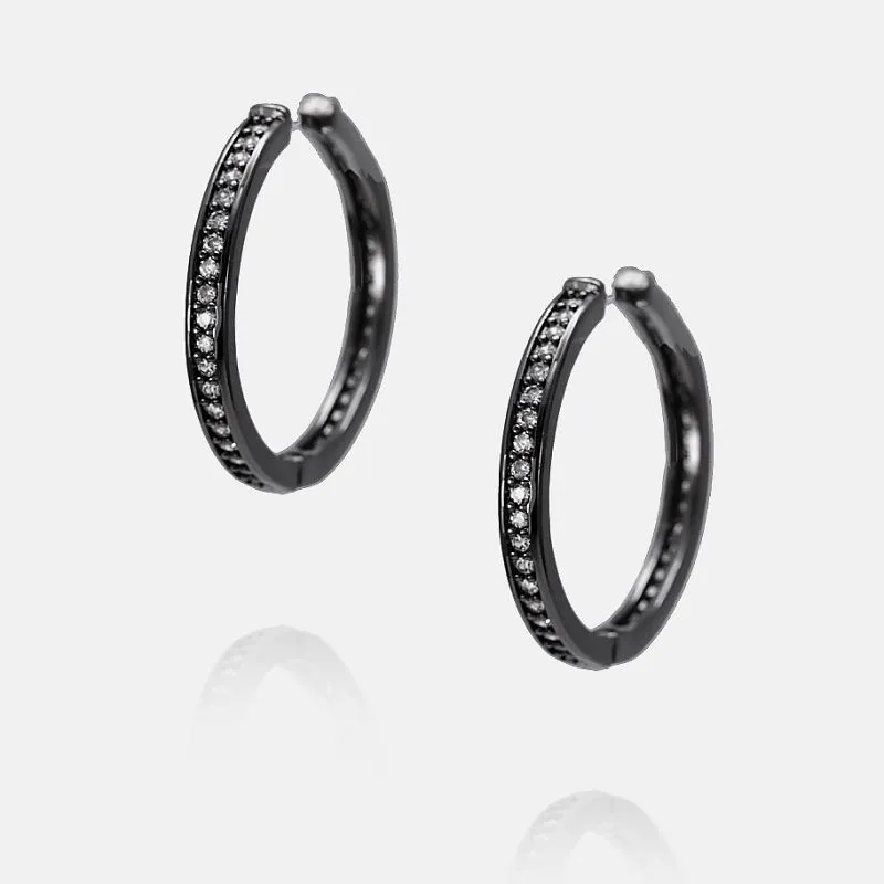 Hematytowany, pozłacany kolczyk w kształcie koła